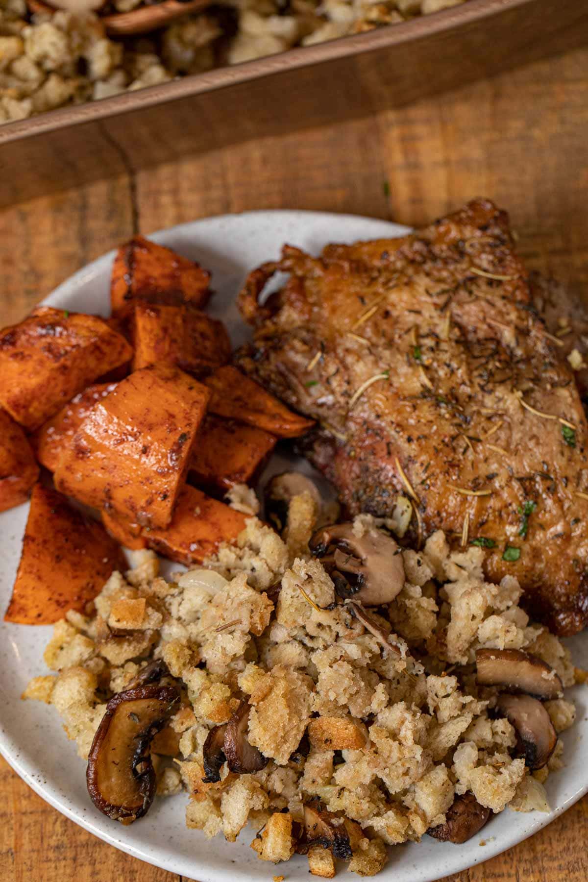 Mushroom Bread Pudding on plate with turkey and sweet potatoes