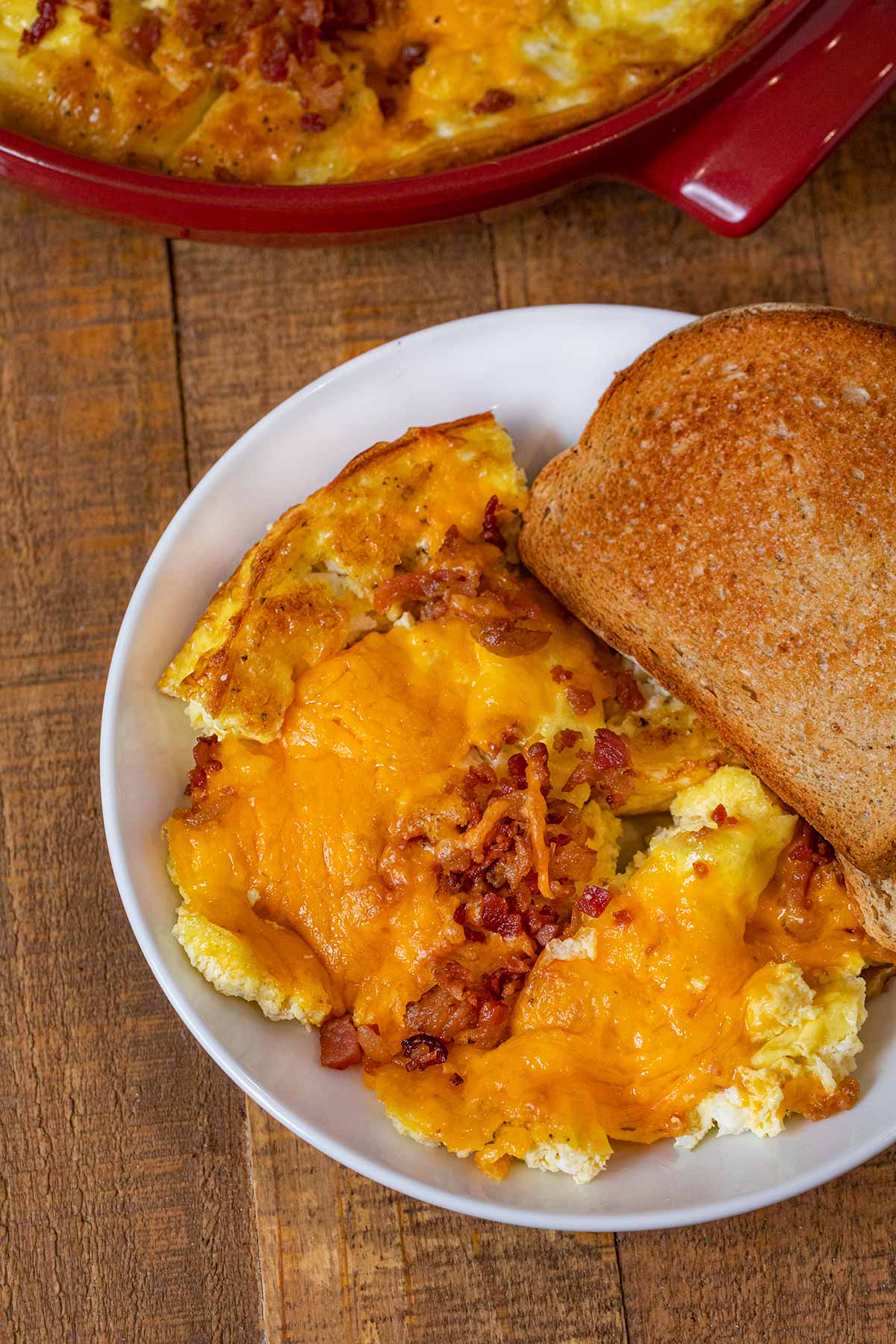 Oven Baked Cheddar Scrambled Eggs serving on plate