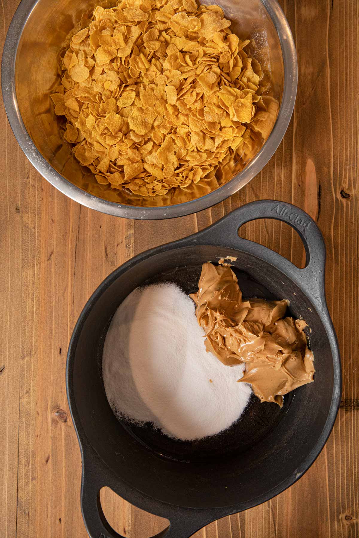 Peanut Butter Cornflake Bars peanut butter and sugar in pot with cornflakes in bowl