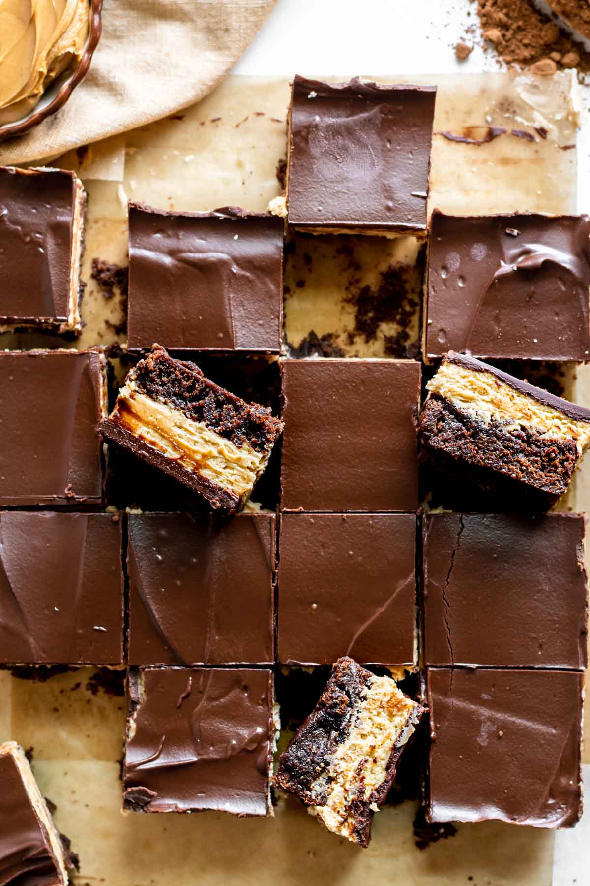 Peanut Butter Truffle Brownies finished cut on parchment paper