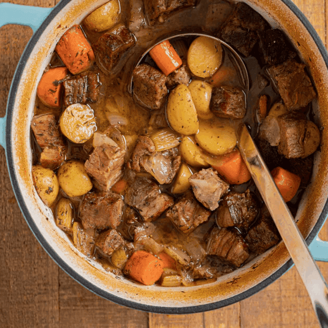 Beef roast soup in a blue pot.