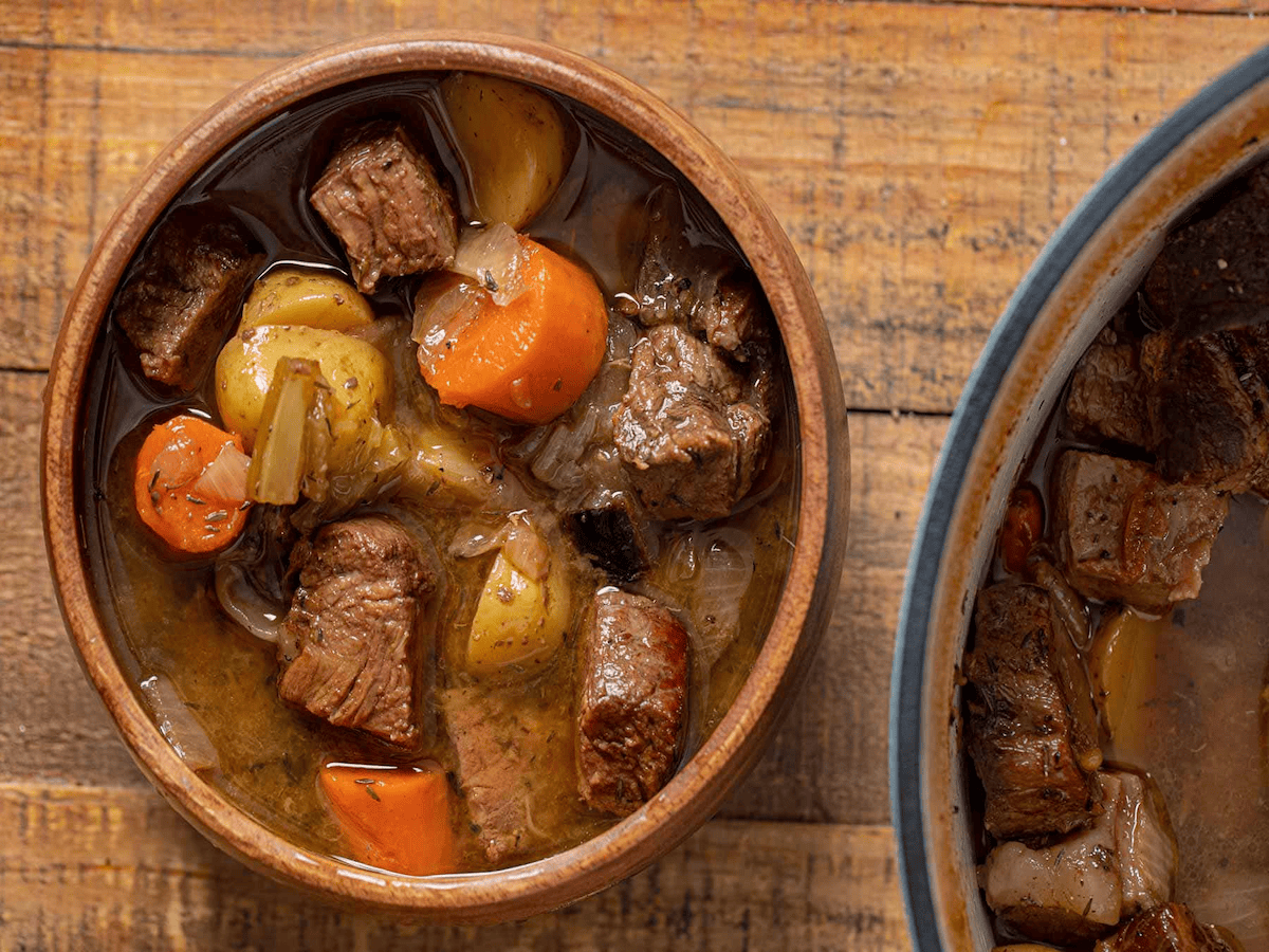 Beef roast in a brown bowl.