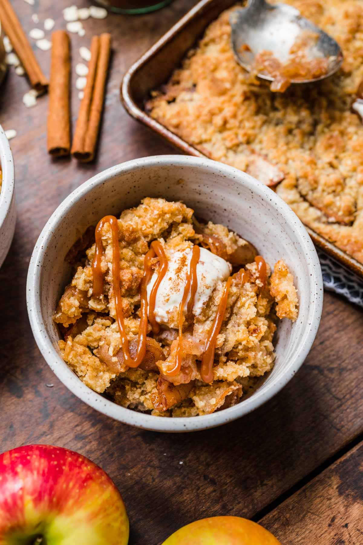 Sheet pan apple crisp served in a bowl.