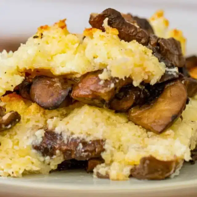 Scoop of mushrooms with cheese in between