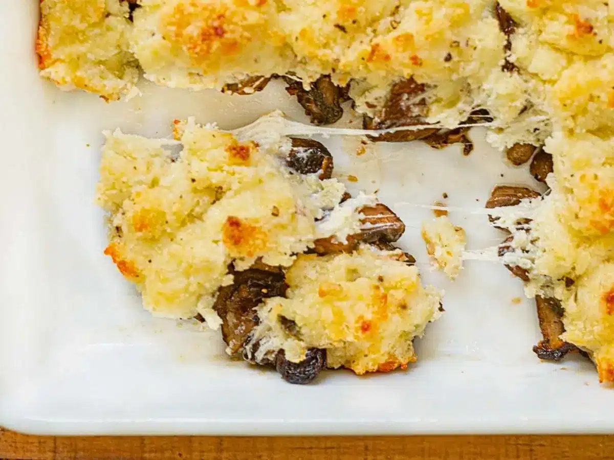 Mushrooms with cheese topping in dish
