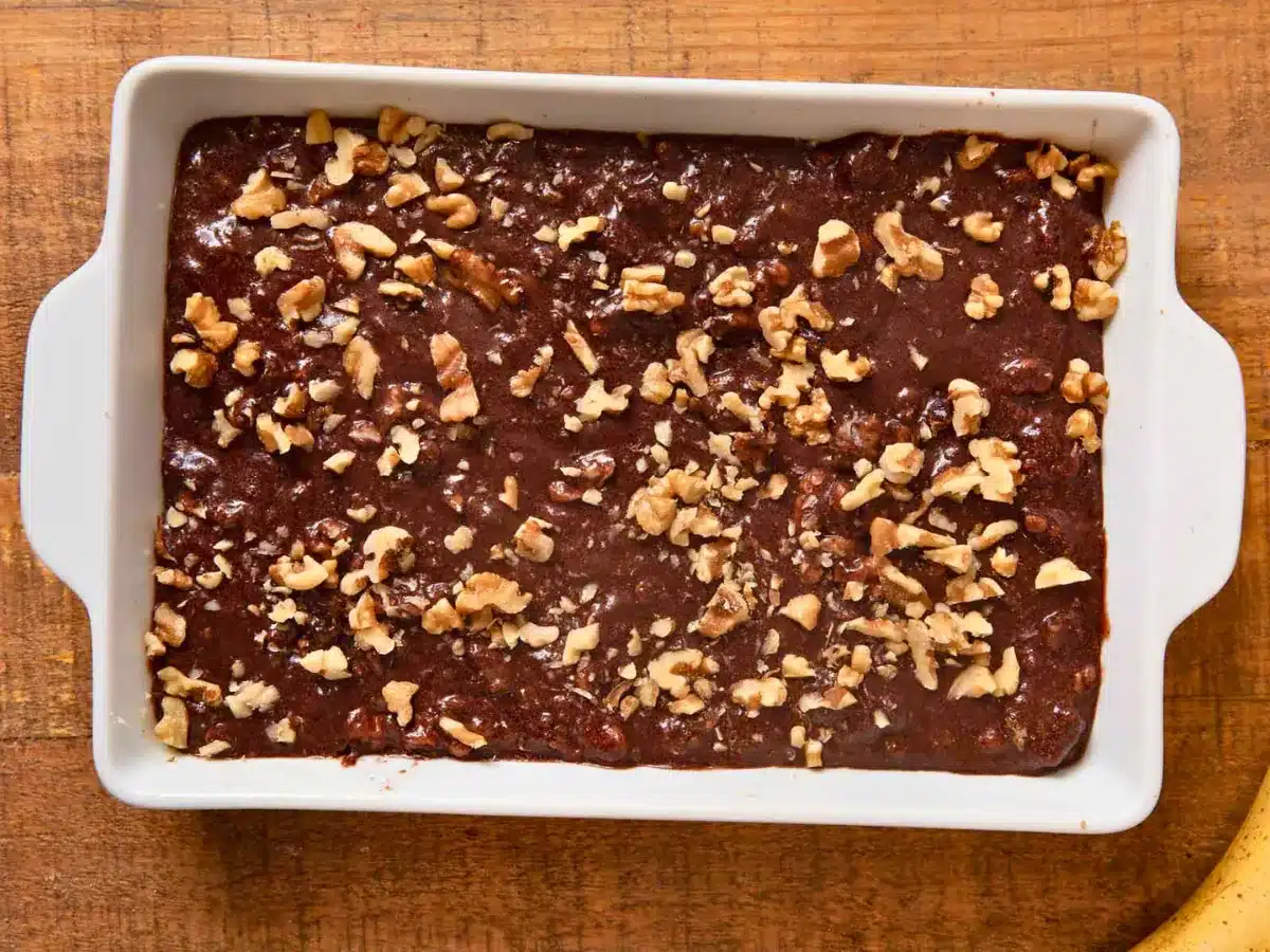 fudgy dessert batter in white porcelain baking dish