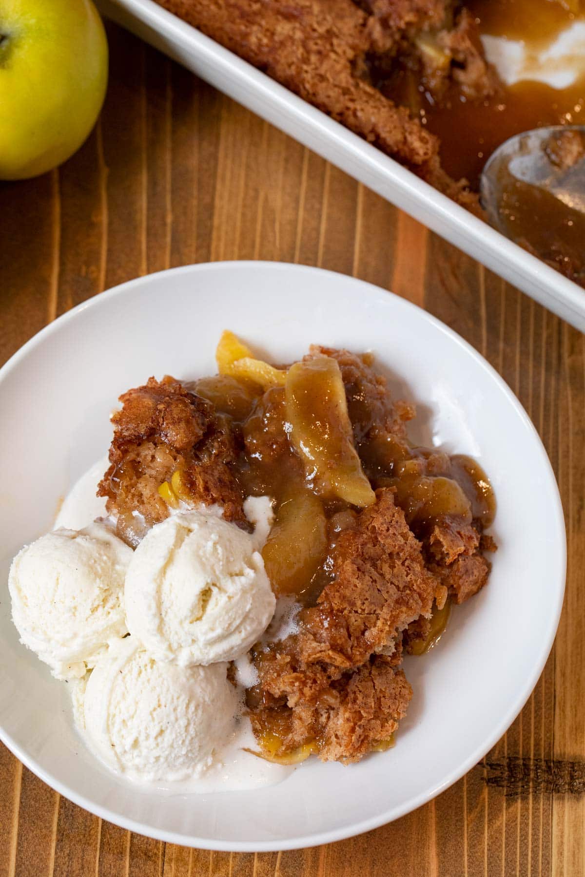 Caramel Apple Cobbler on a plate with vanilla ice cream