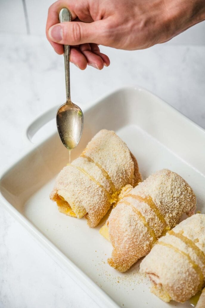 Rolled Chicken Cordon Bleu in baking dish before baking