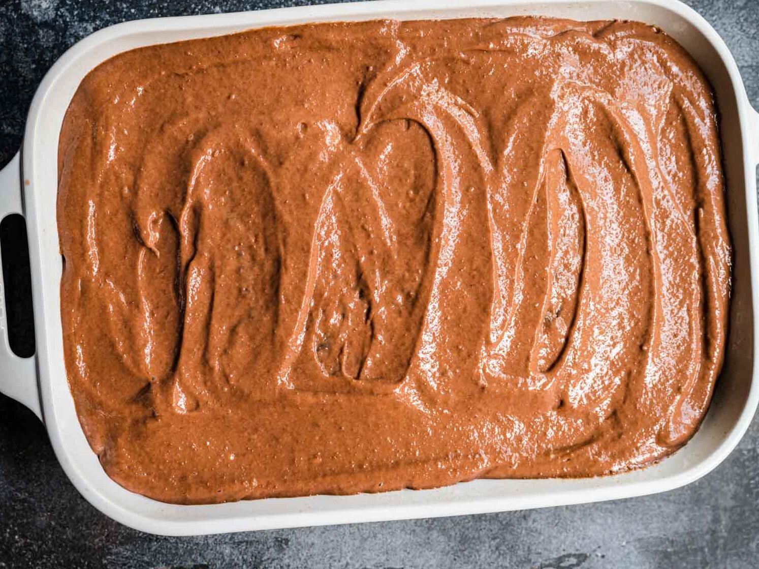 Pudding layer over baked cake in dish