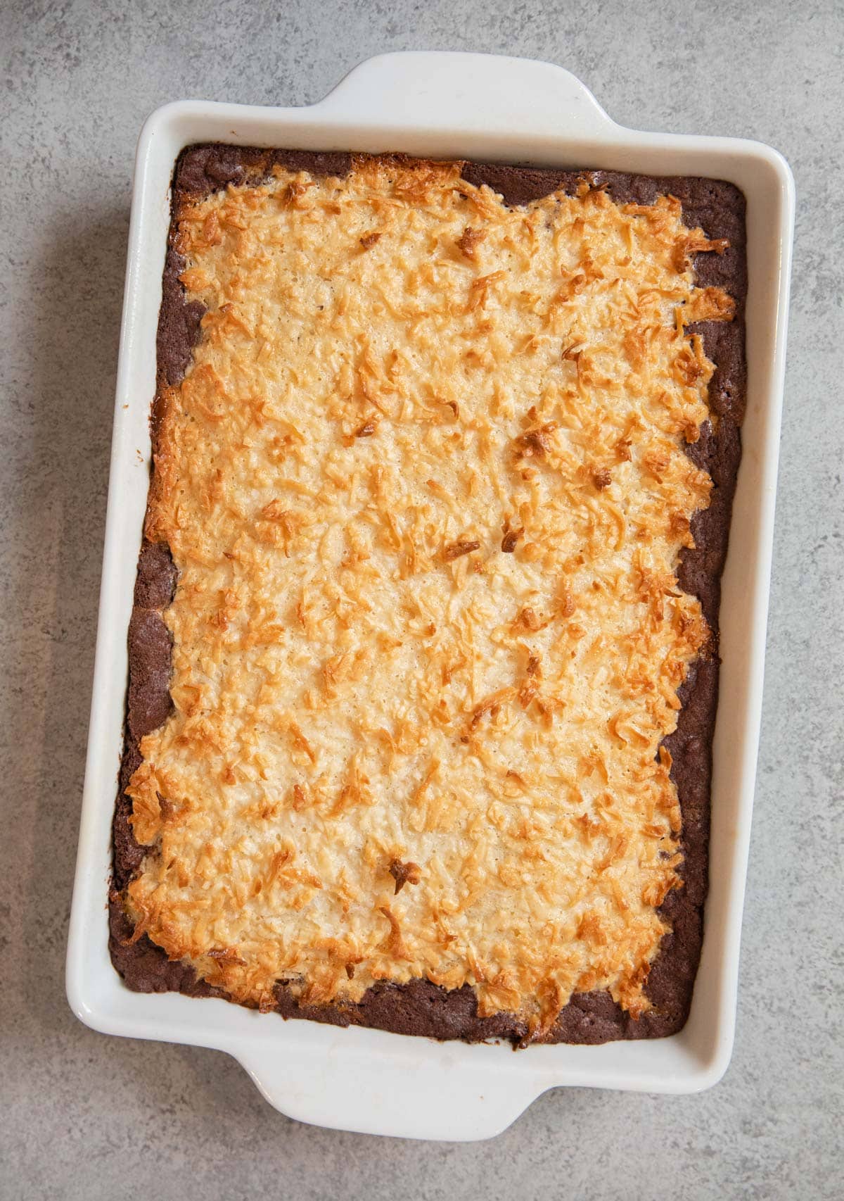 Coconut Macaroon Brownies in white baking dish