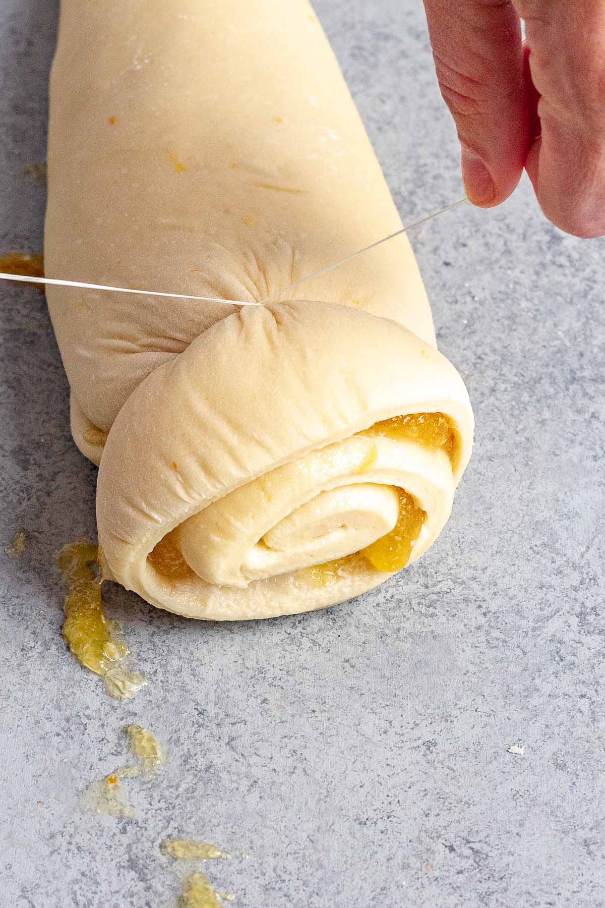 Orange Rolls dough being cut
