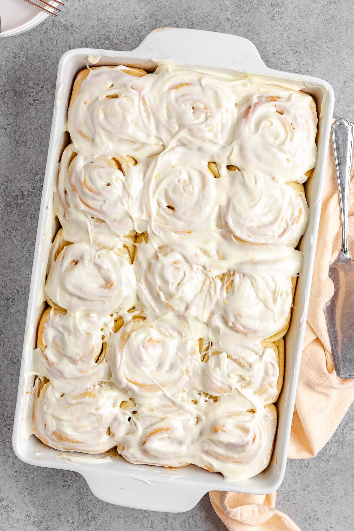 Orange Rolls with frosting in baking pan