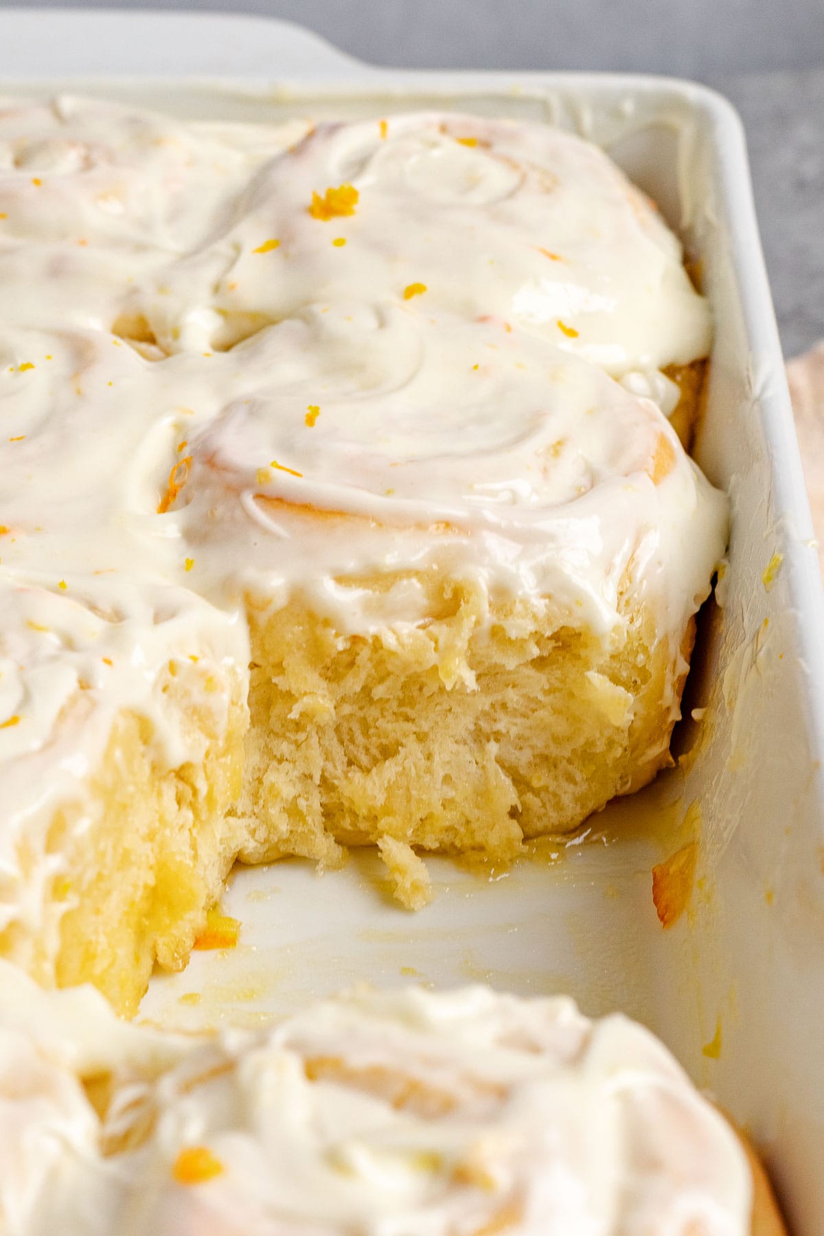 Orange Rolls with frosting in baking pan