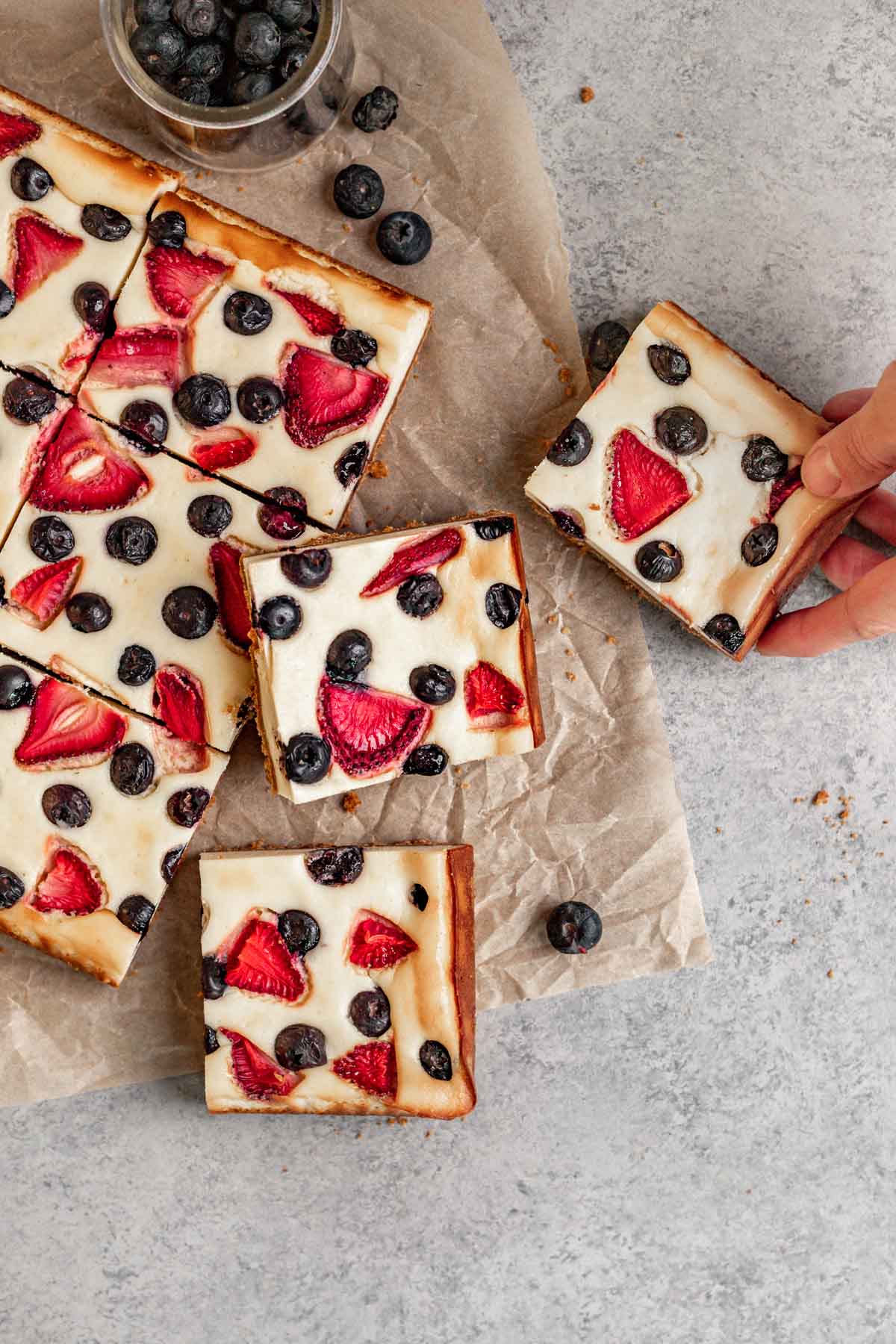 Red White and Blue Cheesecake Bars on parchment