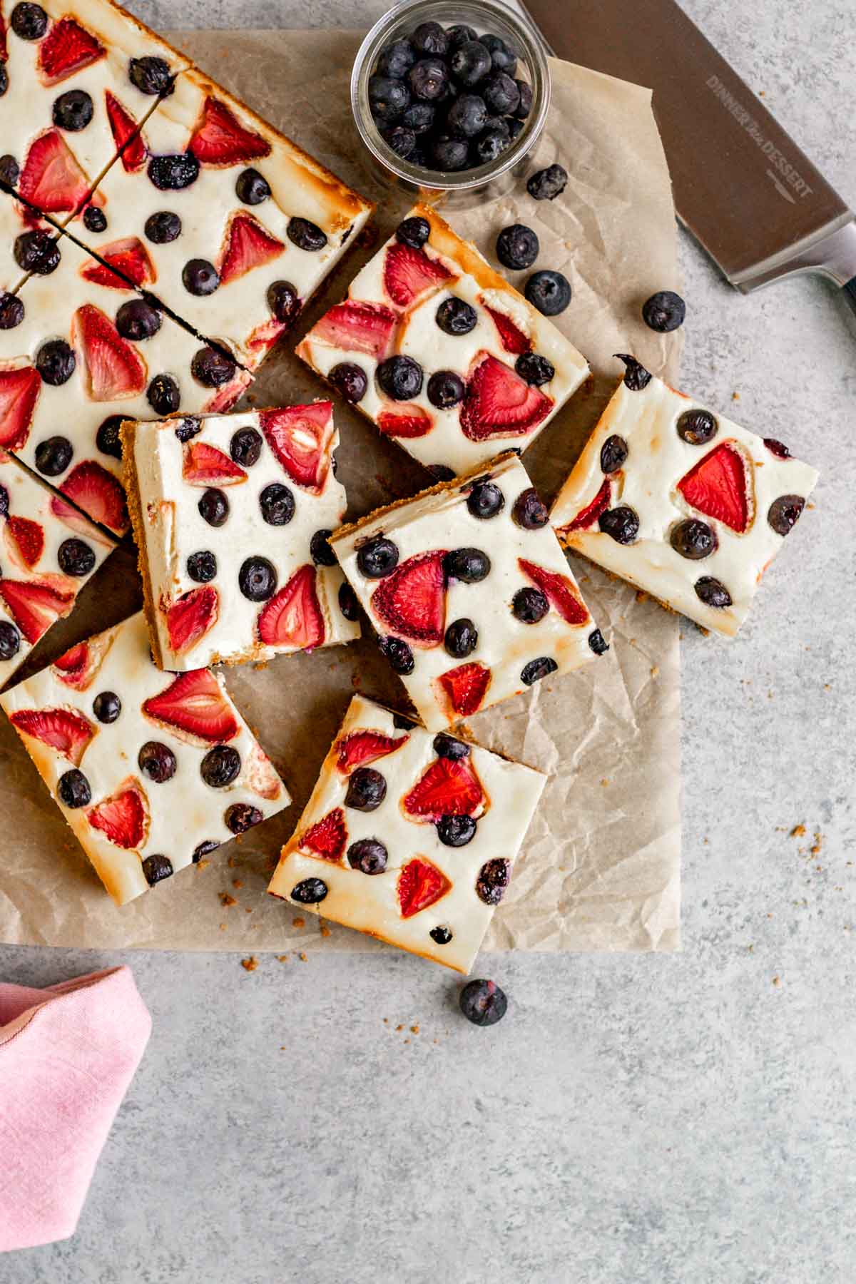 Red White and Blue Cheesecake Bars on parchment