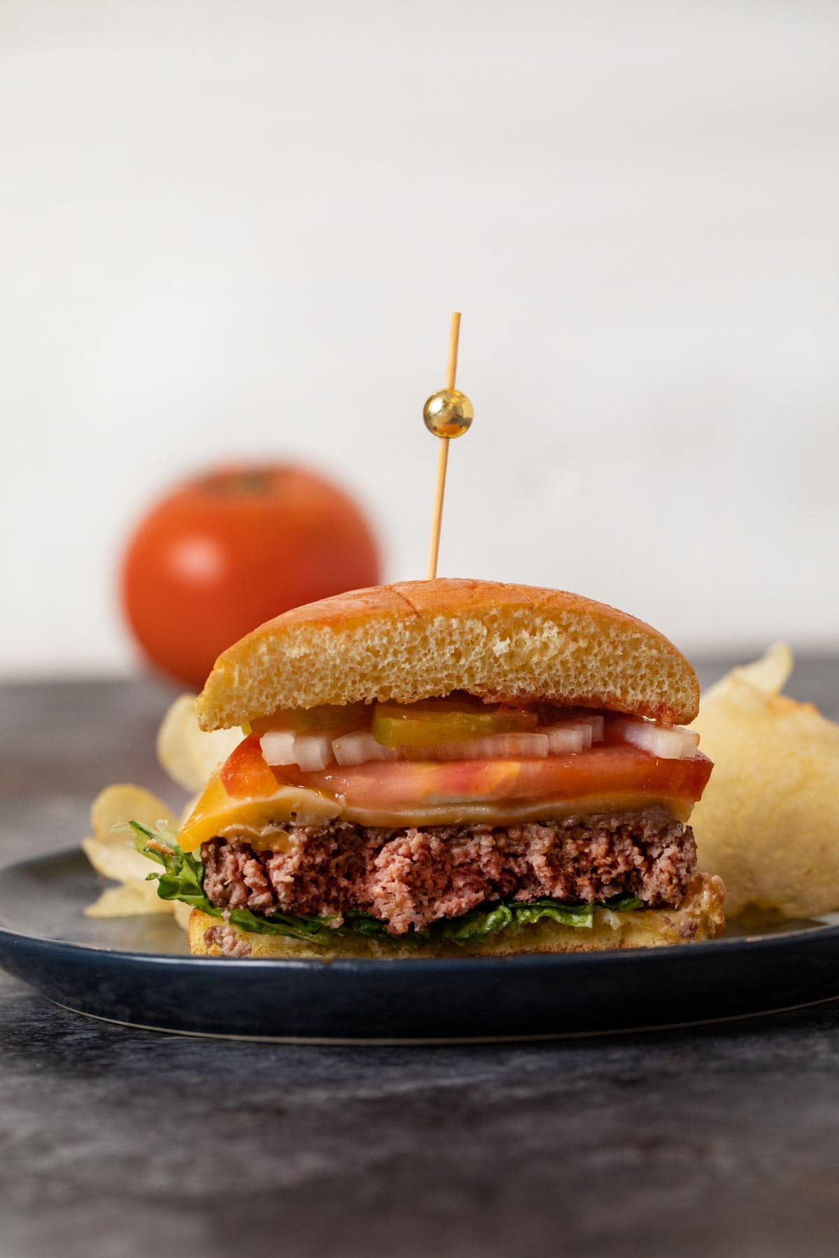 Stovetop Burger sliced in half on plate