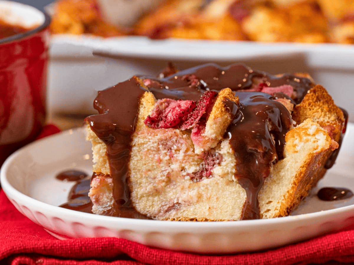 side view of hazelnut spread and berries on a white plate