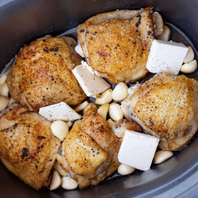 Chicken thighs with lots of garlic and butter in slow cooker