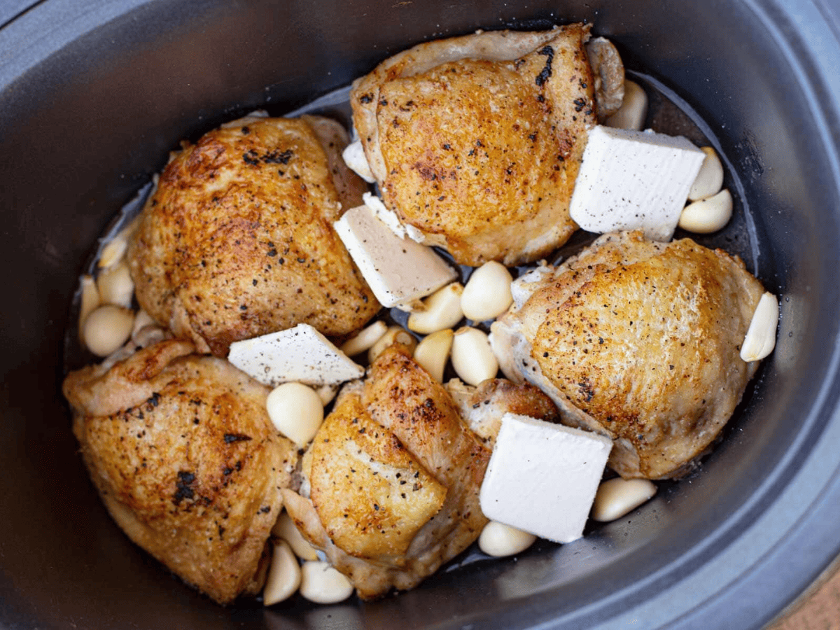 Chicken thighs with lots of garlic and butter in slow cooker