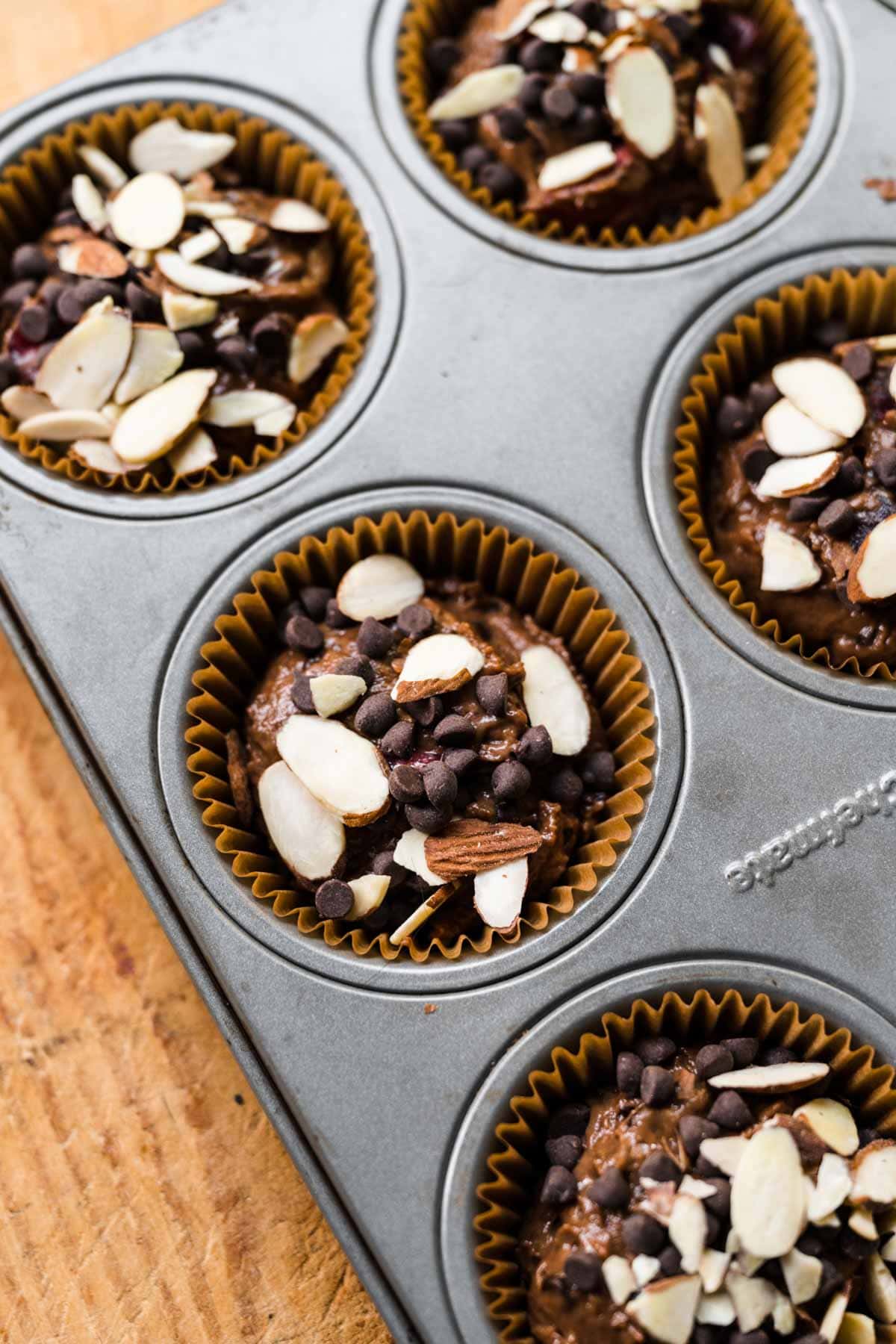 Almond Cherry Chocolate Muffins batter in muffin pan