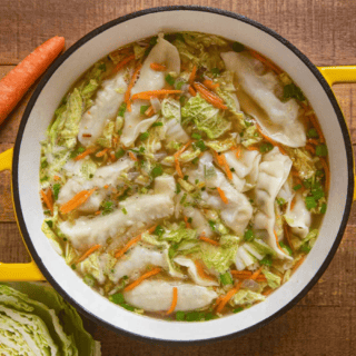 soup with vegetables and potstickers in a pot