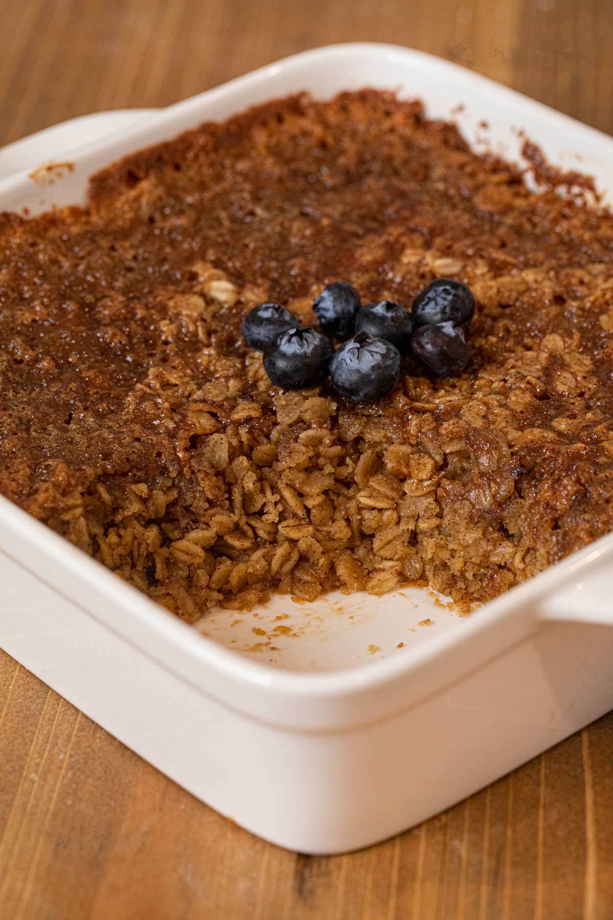 Baked Oatmeal in baking dish with portion removed