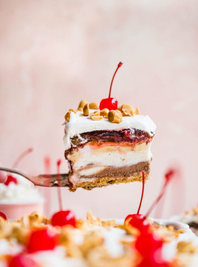 No-Bake Banana Split Dessert slice from pan showing layers