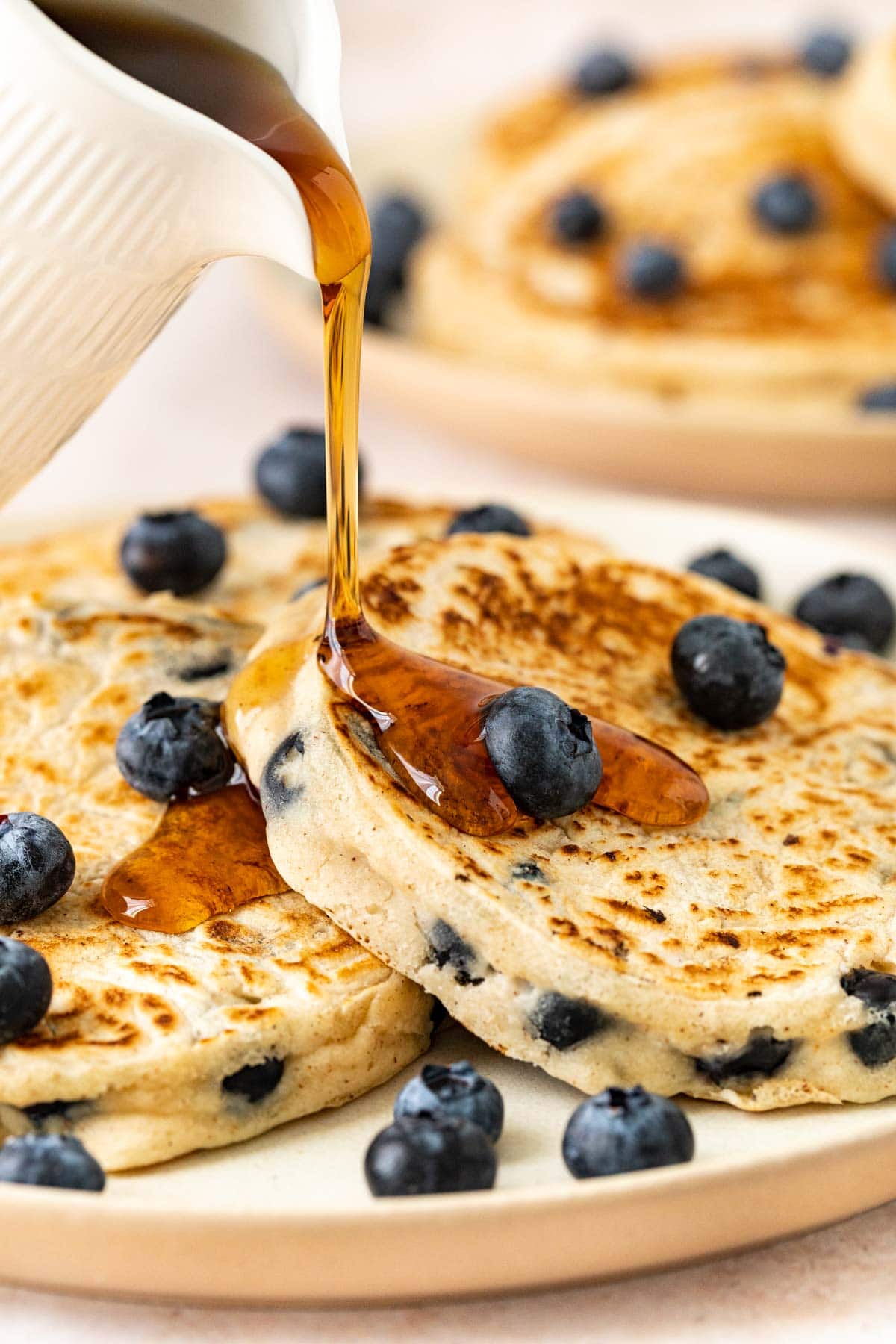 Blueberry Pancakes on plate with syrup