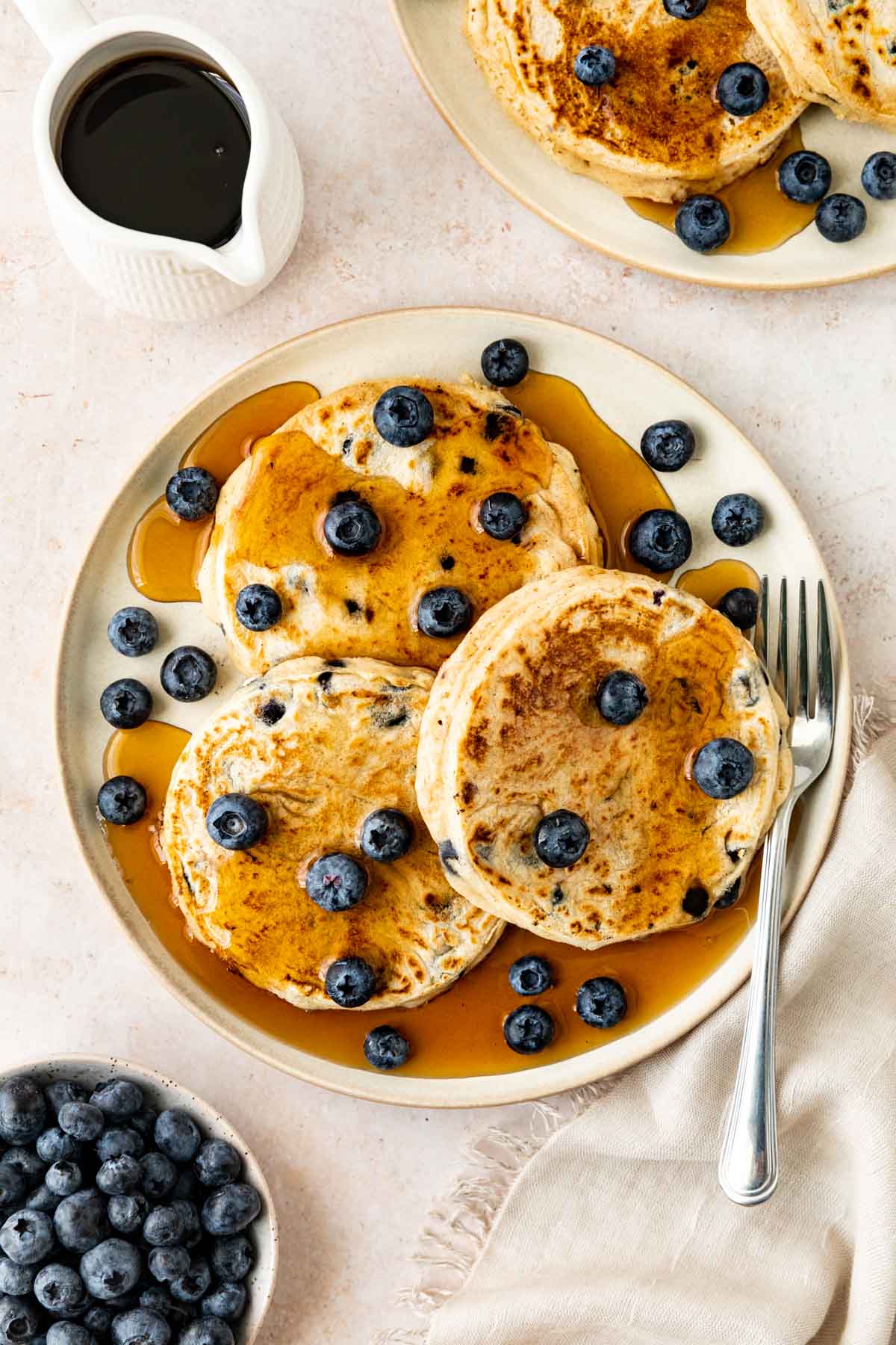 Blueberry Pancakes on plate with syrup