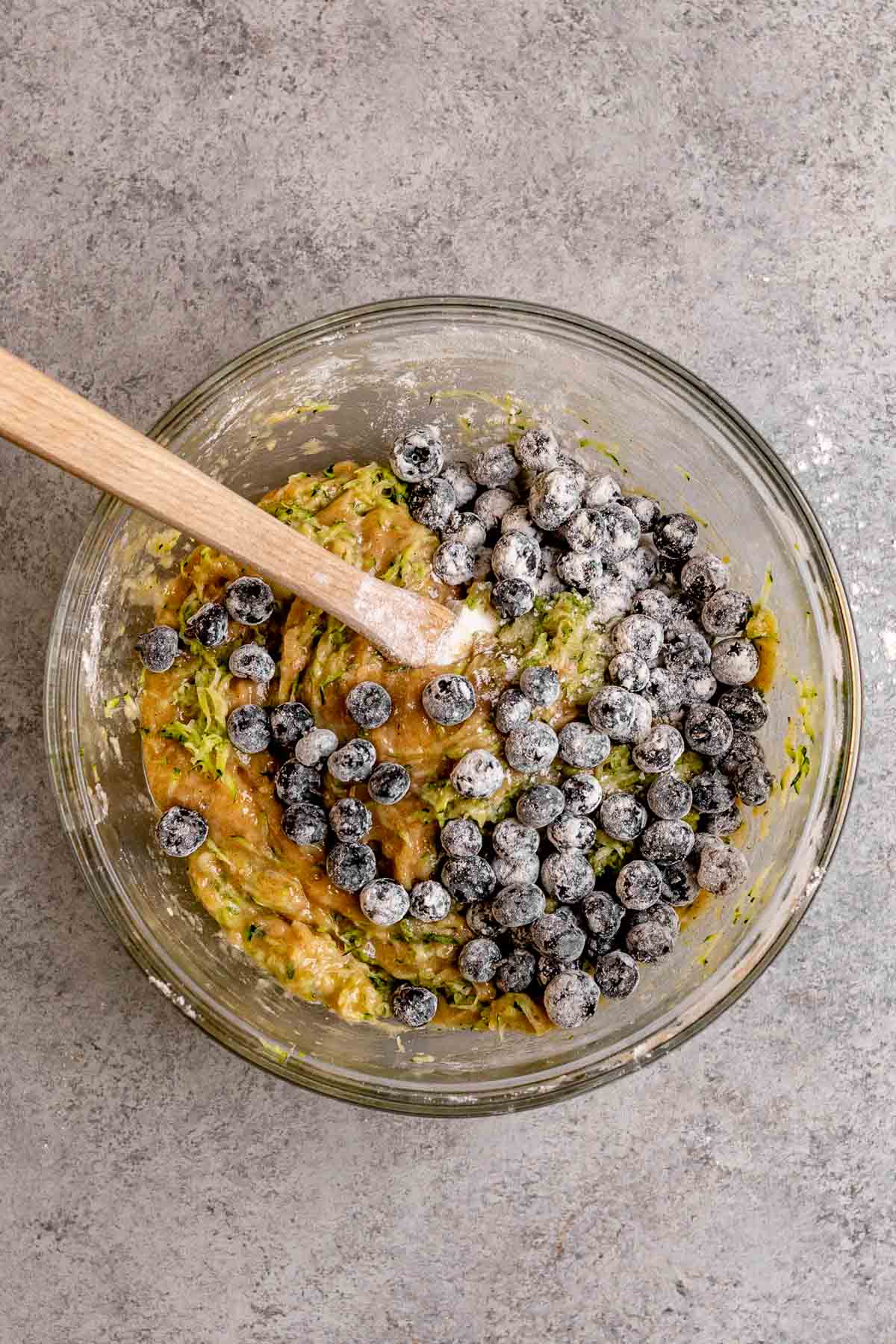 Blueberries added to batter for Blueberry Zucchini Bread in mixing bowl