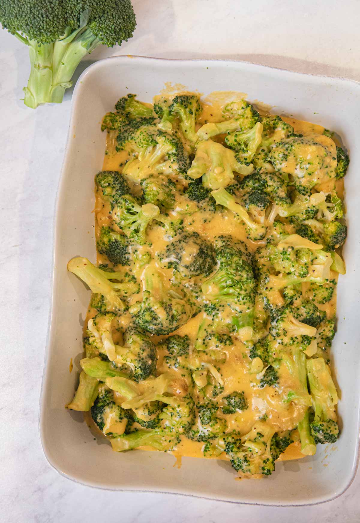 Cheesy Garlic Casserole in baking dish without bread crumbs