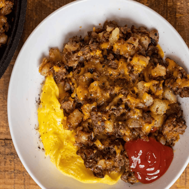 White plate potato hash and eggs