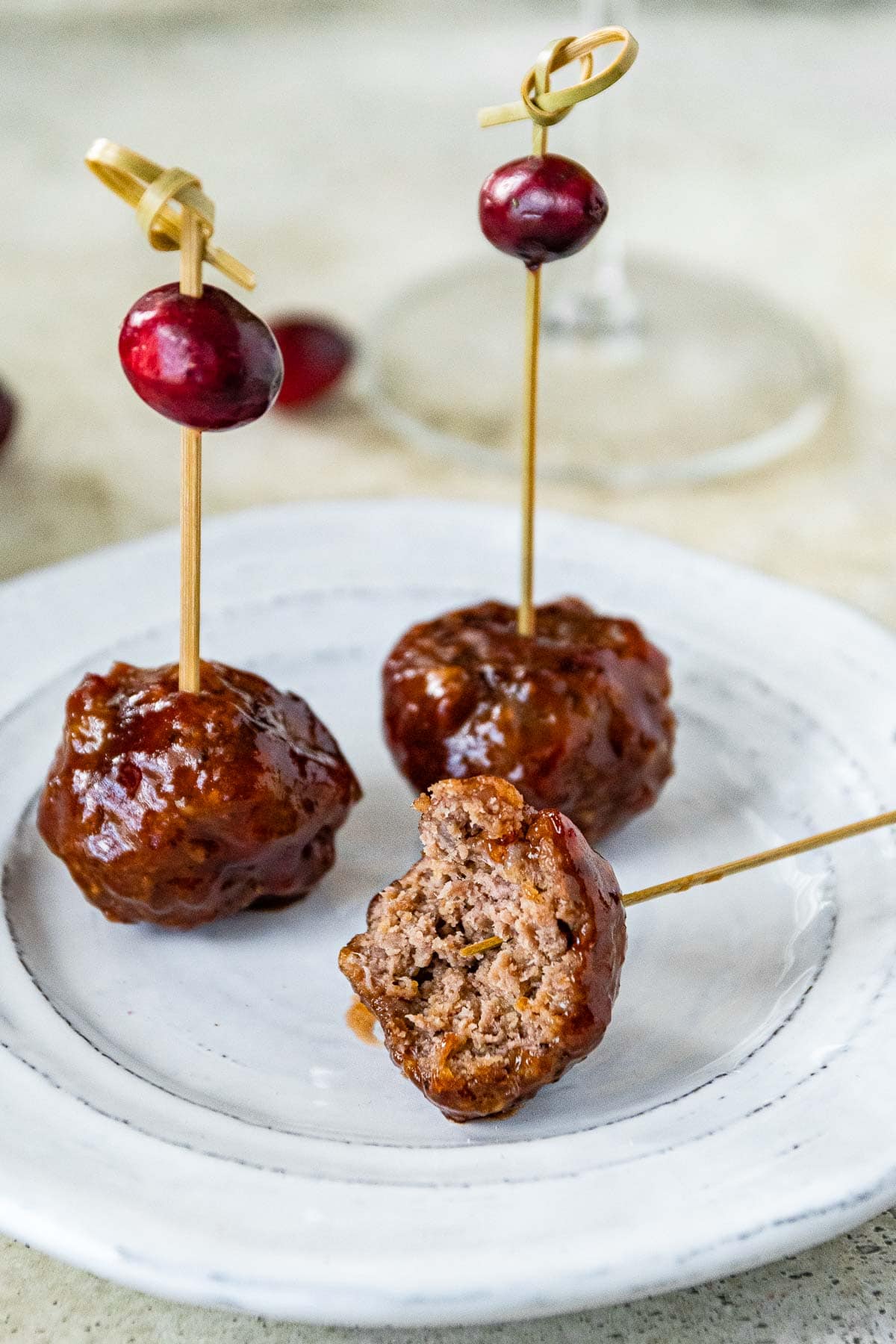 Cranberry Meatballs on serving plate showing interior