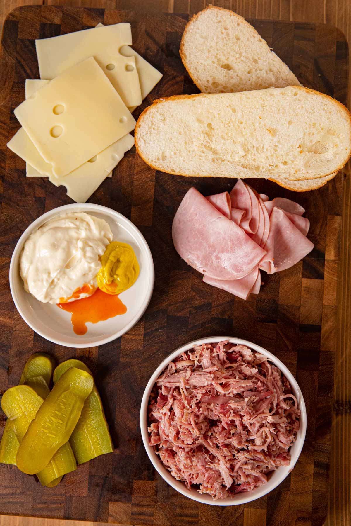 Cuban Sandwich ingredients spread out on large cutting board