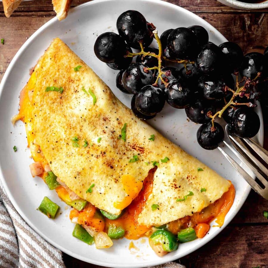 Denver Omelette on plate with black grapes