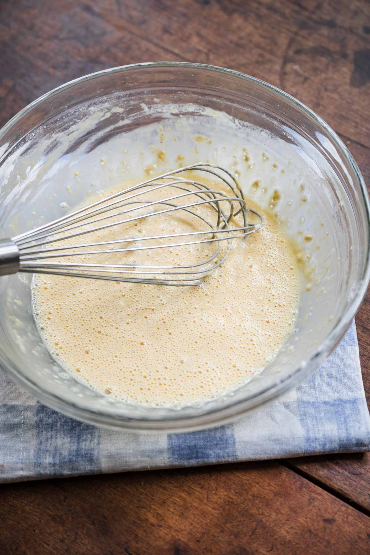 Skillet Baked Pancake batter in bowl with whisk