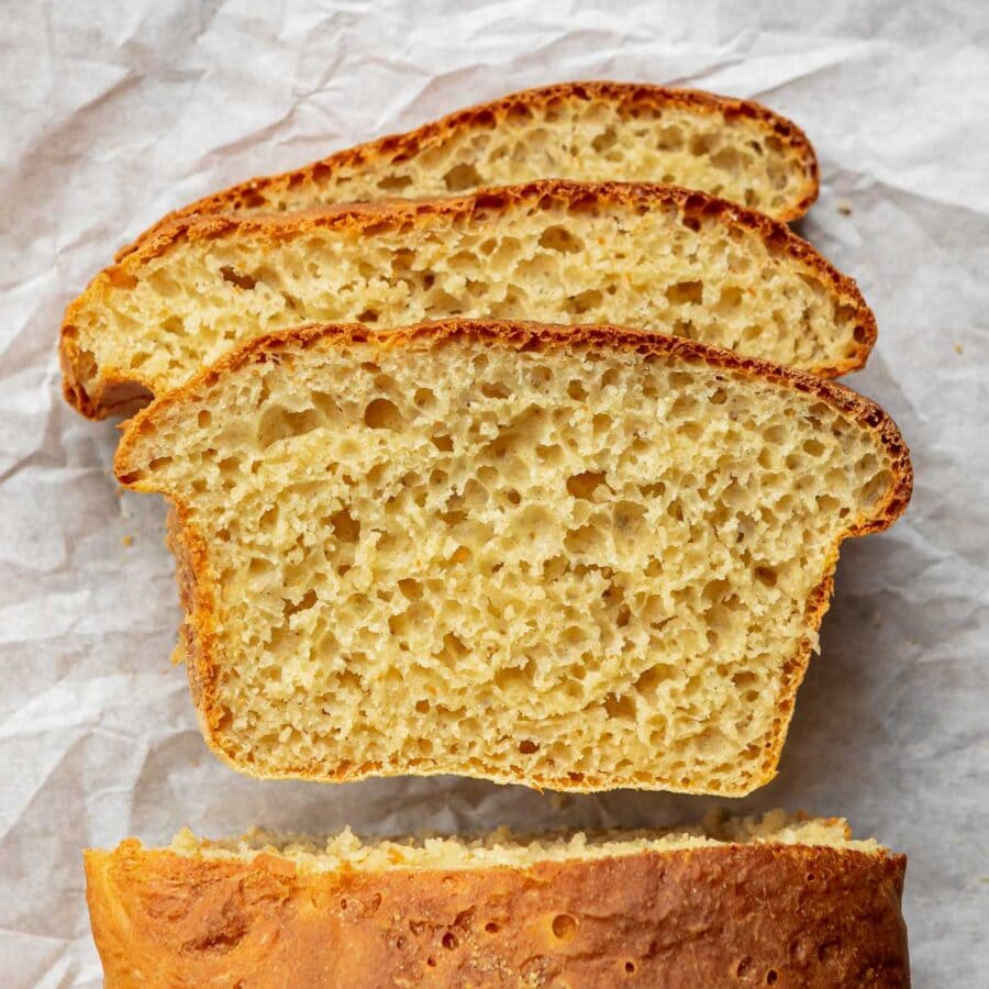 English Muffin Bread slices on parchment paper