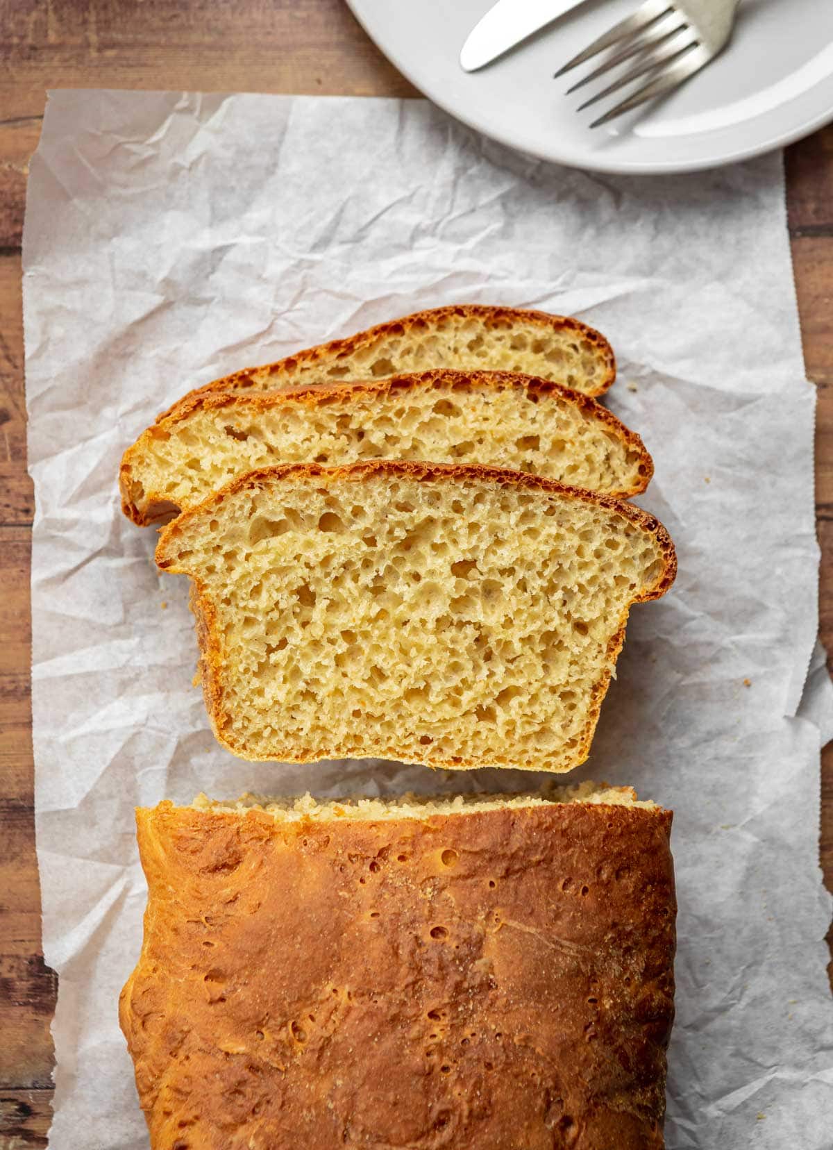 English Muffin Bread slices on parchment paper