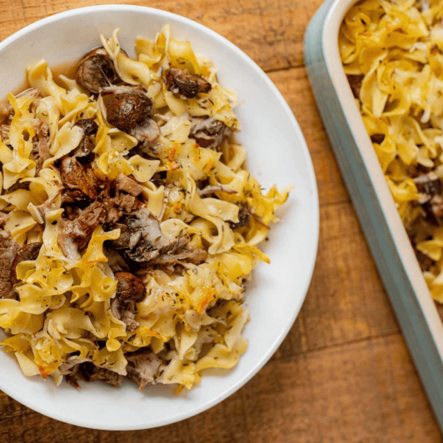 plated noodle bake and baking dish to the side