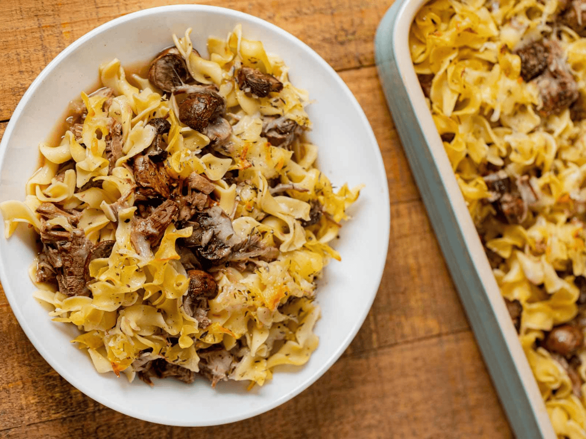 plated noodle bake and baking dish to the side 