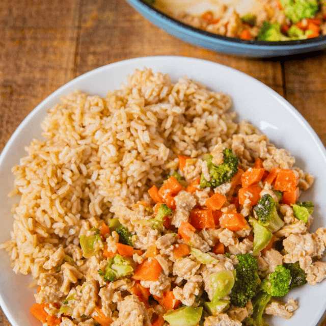 Ground chicken and vegetables on a plate with rice