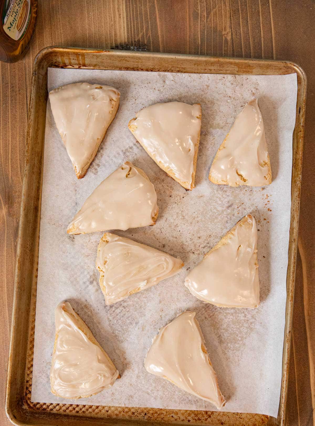Maple Scones on baking sheet covered with icing