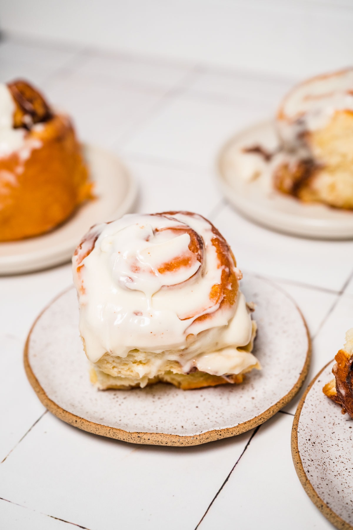 Nutella Cinnamon Rolls on serving plate with icing