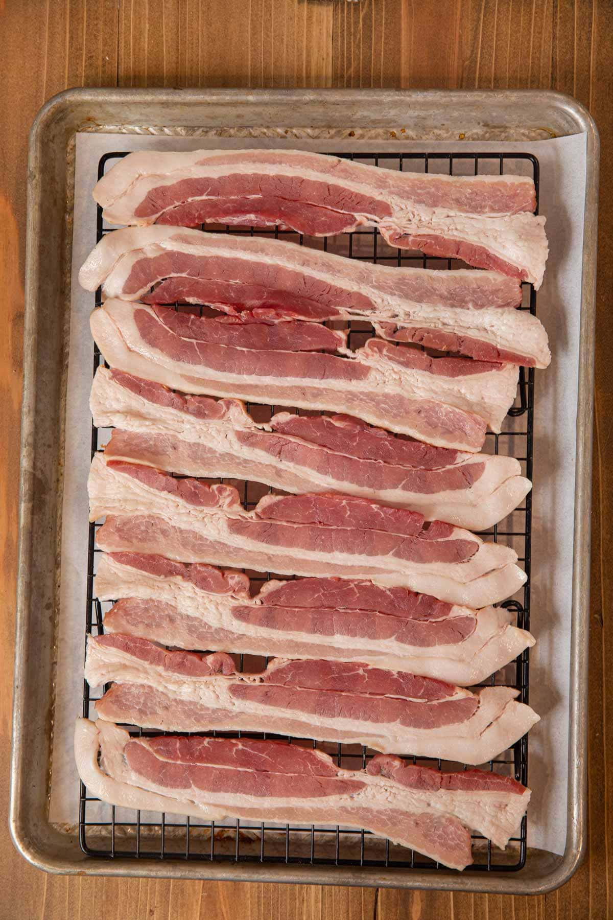 Oven Baked Bacon on rack over baking sheet before cooking