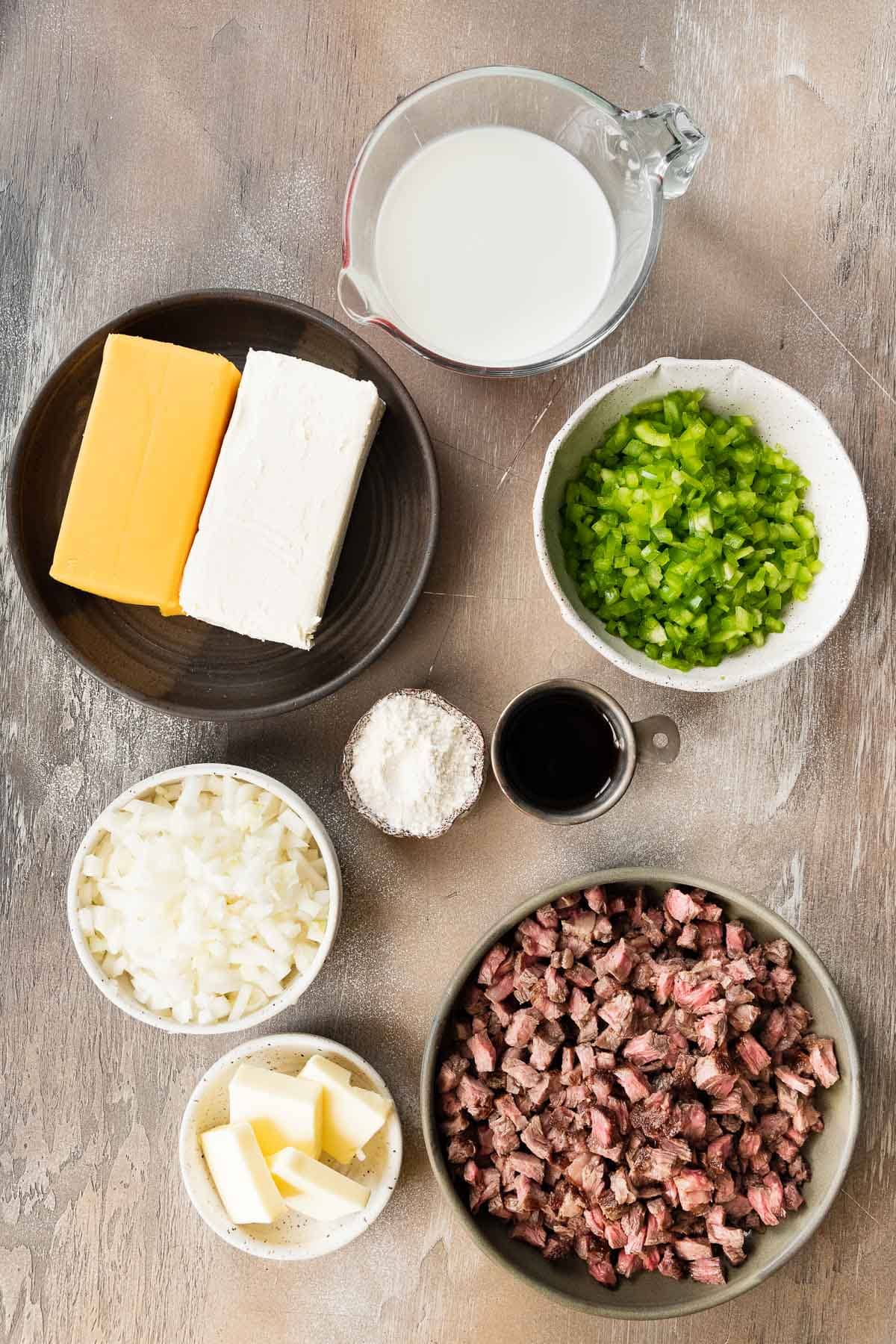 Ingredients for Philly Cheesesteak Dip in prep bowls