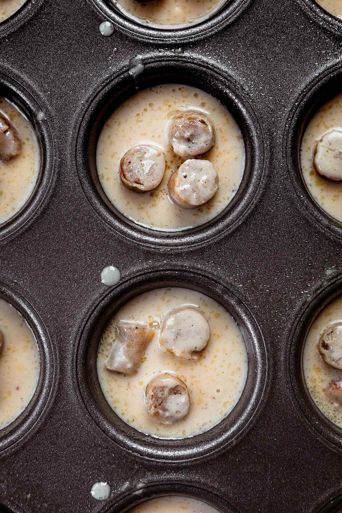 Pigs in a Pool in muffin tins before baking