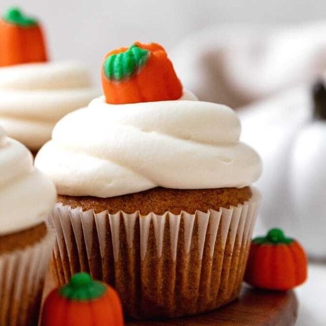 Pumpkin Cupcakes frosted with pumpkin candy on top