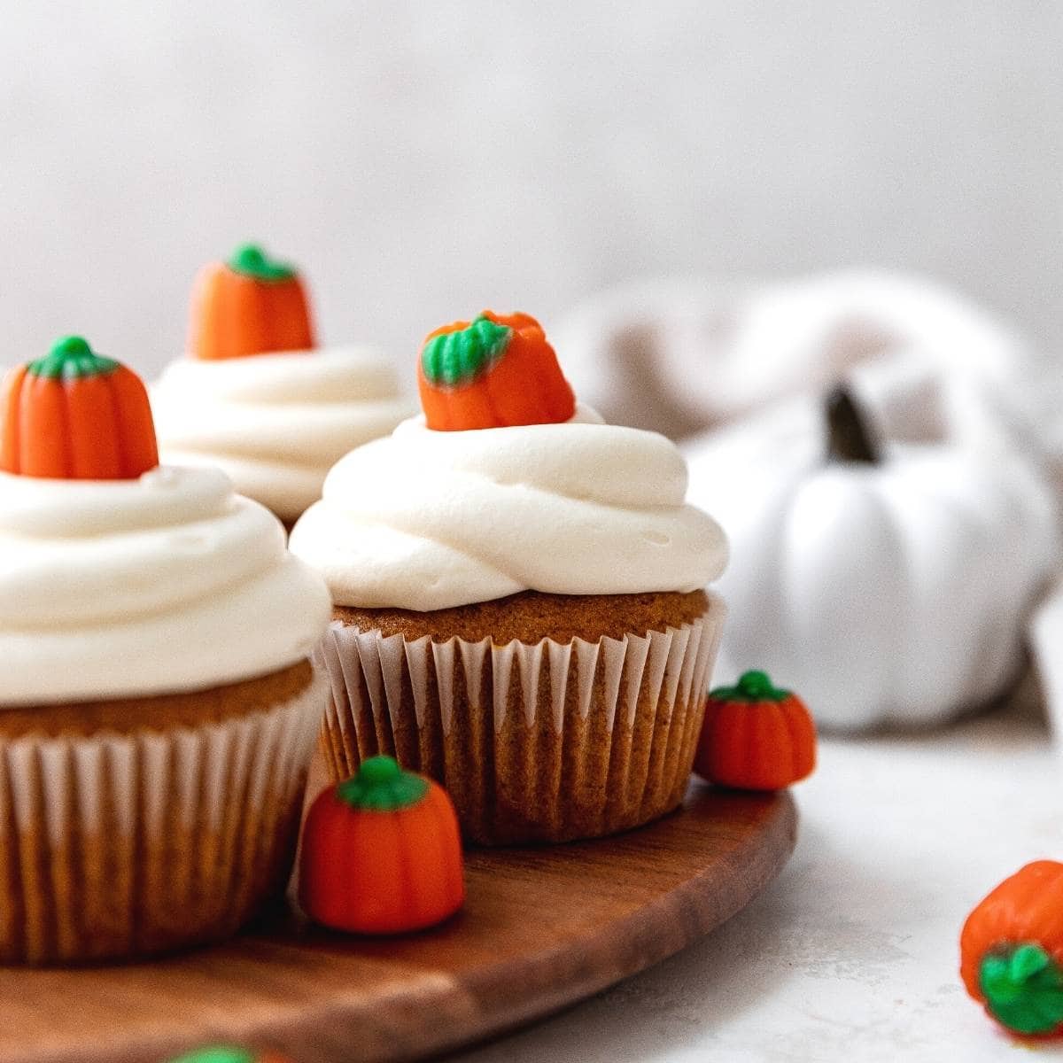 Pumpkin Cupcakes frosted with pumpkin candy on top