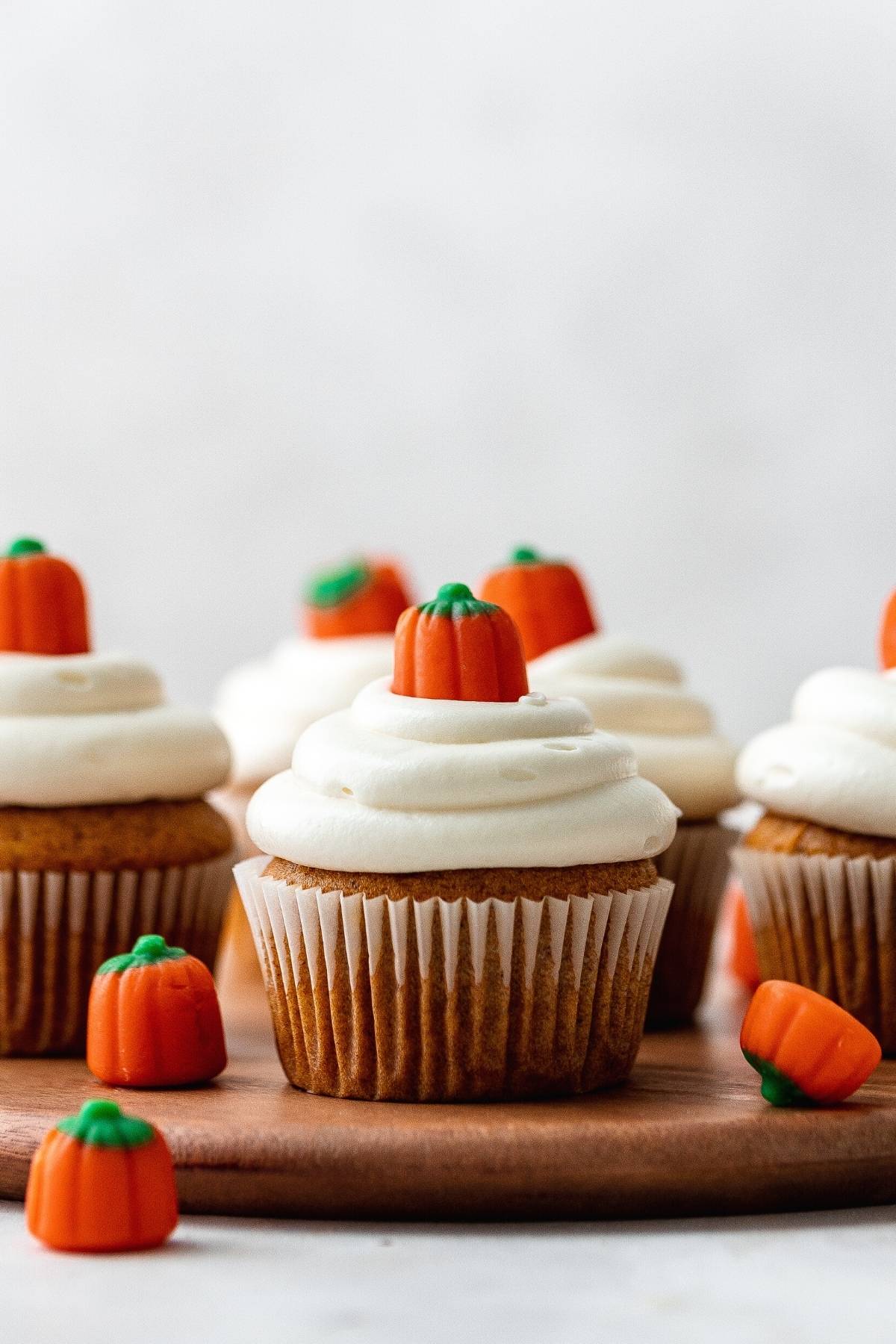 Pumpkin Cupcakes frosted with pumpkin candy on top