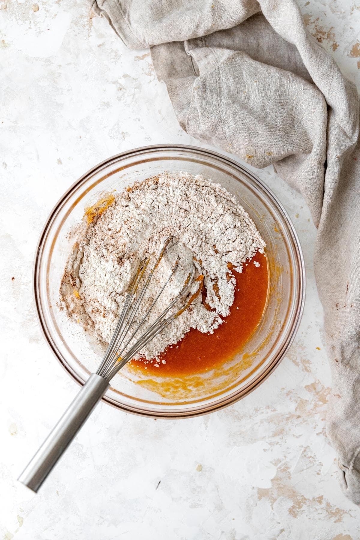 Pumpkin Cupcake batter in mixing bowl with whisk